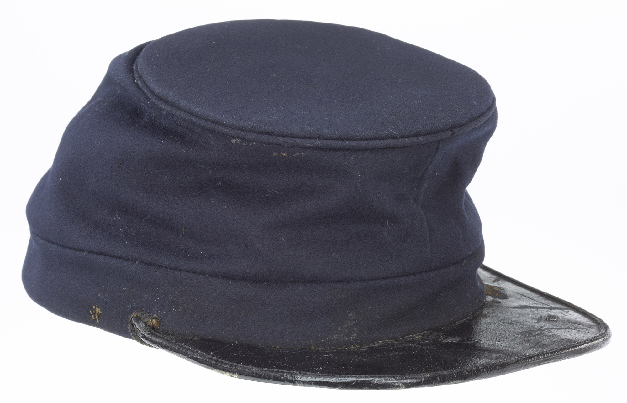 A blue cylindrical cap with a small black brim